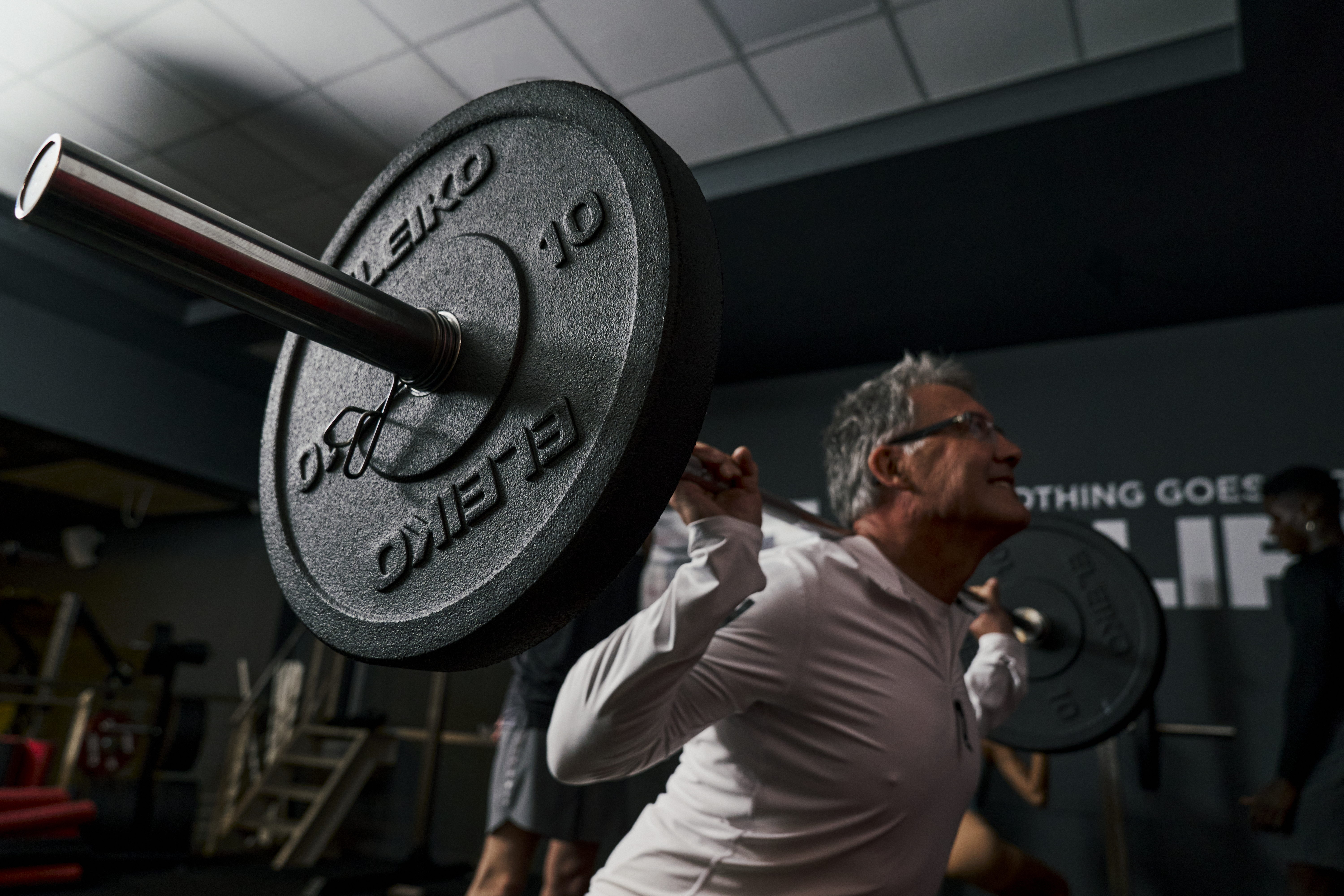 Man squatting in Lift Club