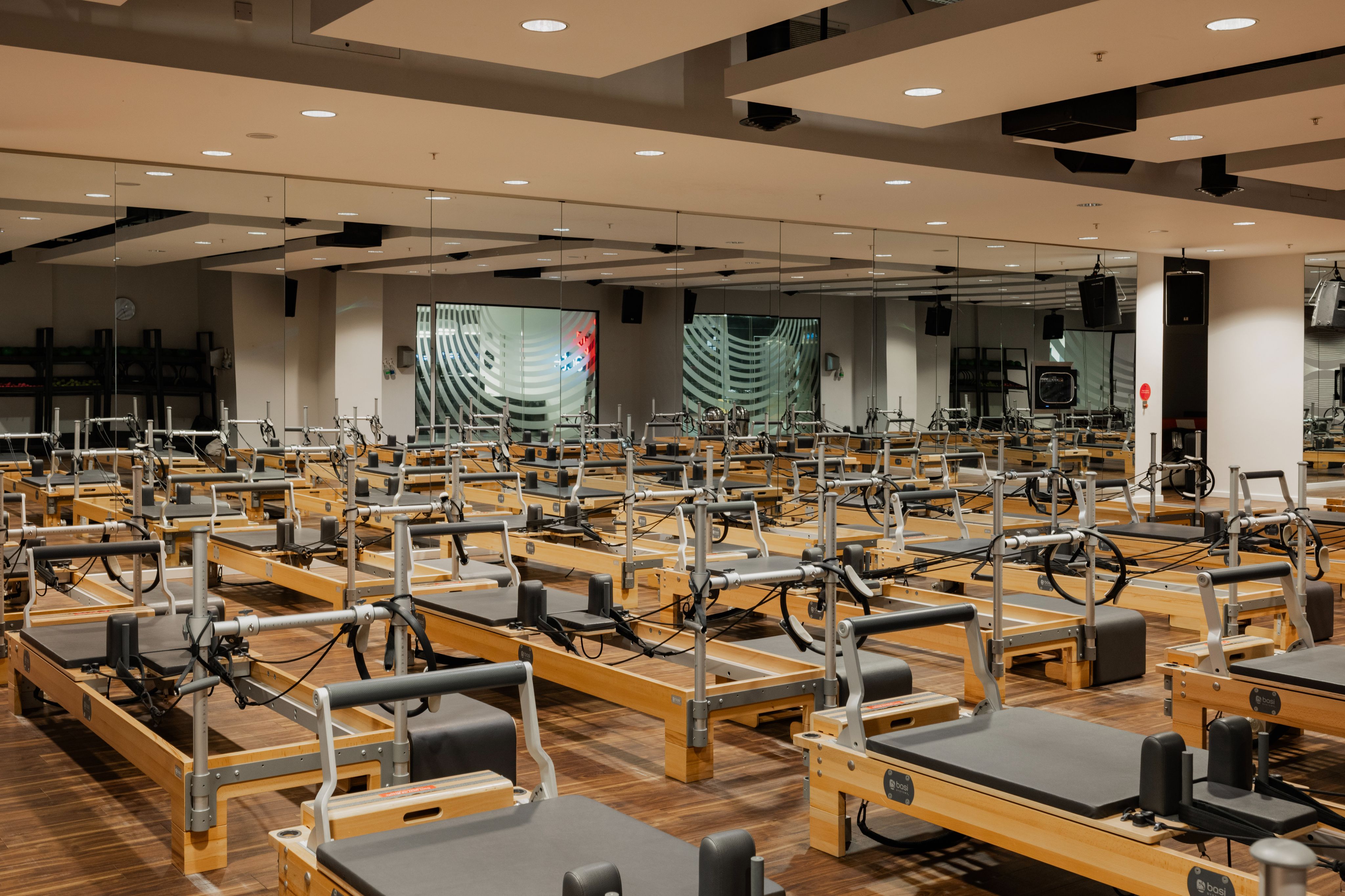 Virgin Active_Aldersgate_Reformer Pilates 2 Man at the front of a Reformer Pilates class