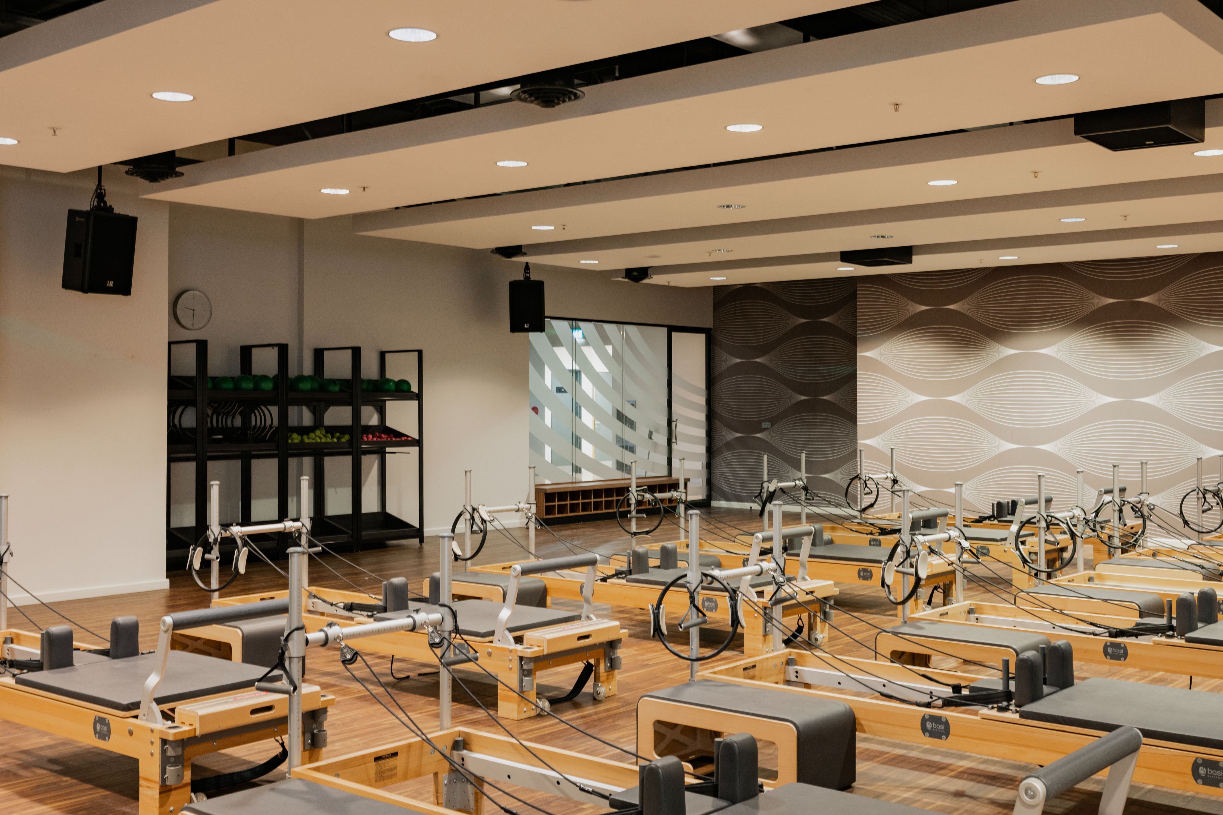 Virgin Active_Aldersgate_Reformer Pilates 3 Man at the front of a Reformer Pilates class