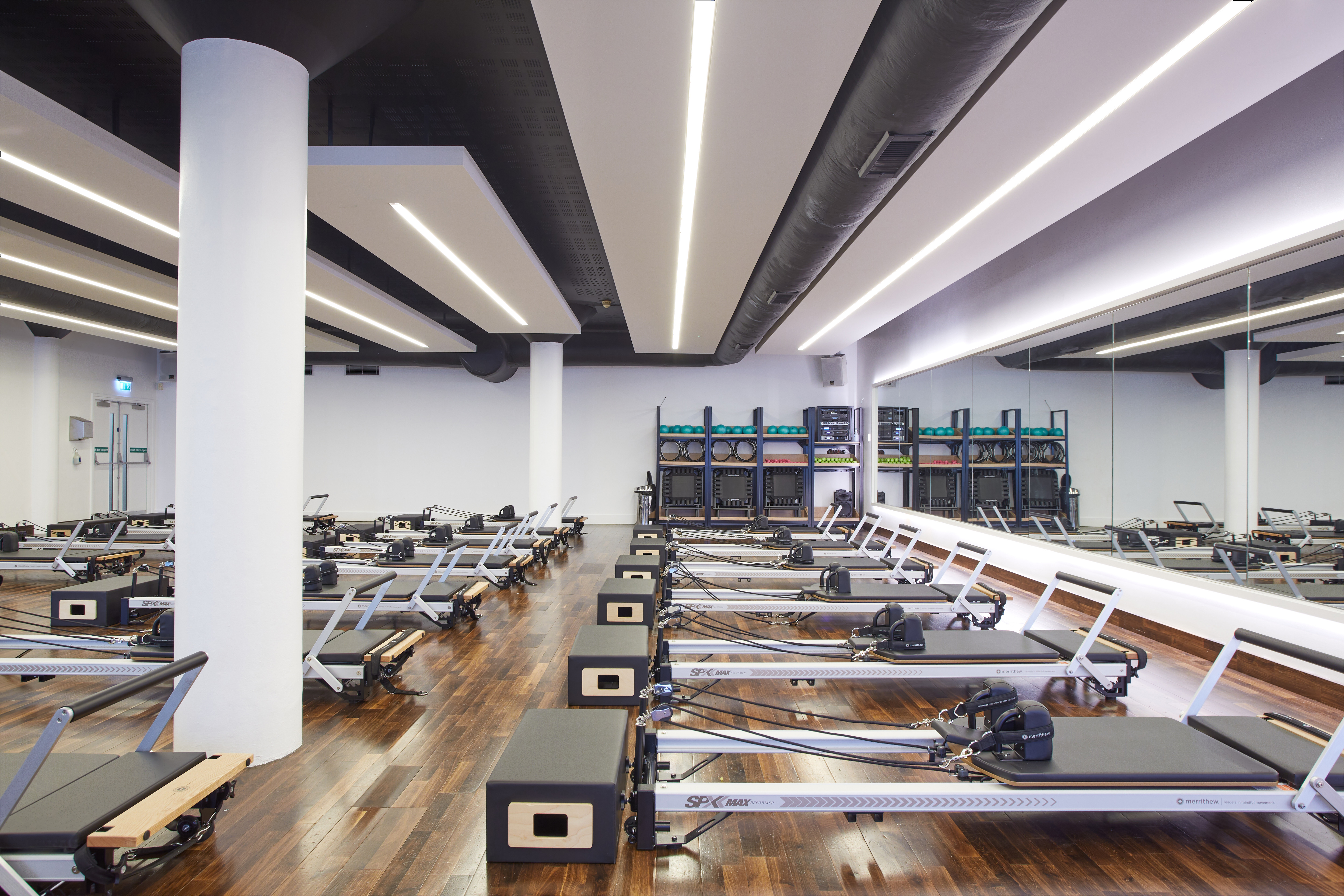 Virgin Active_Wimbledon_GEX_Reformer2 Man at the front of a Reformer Pilates class